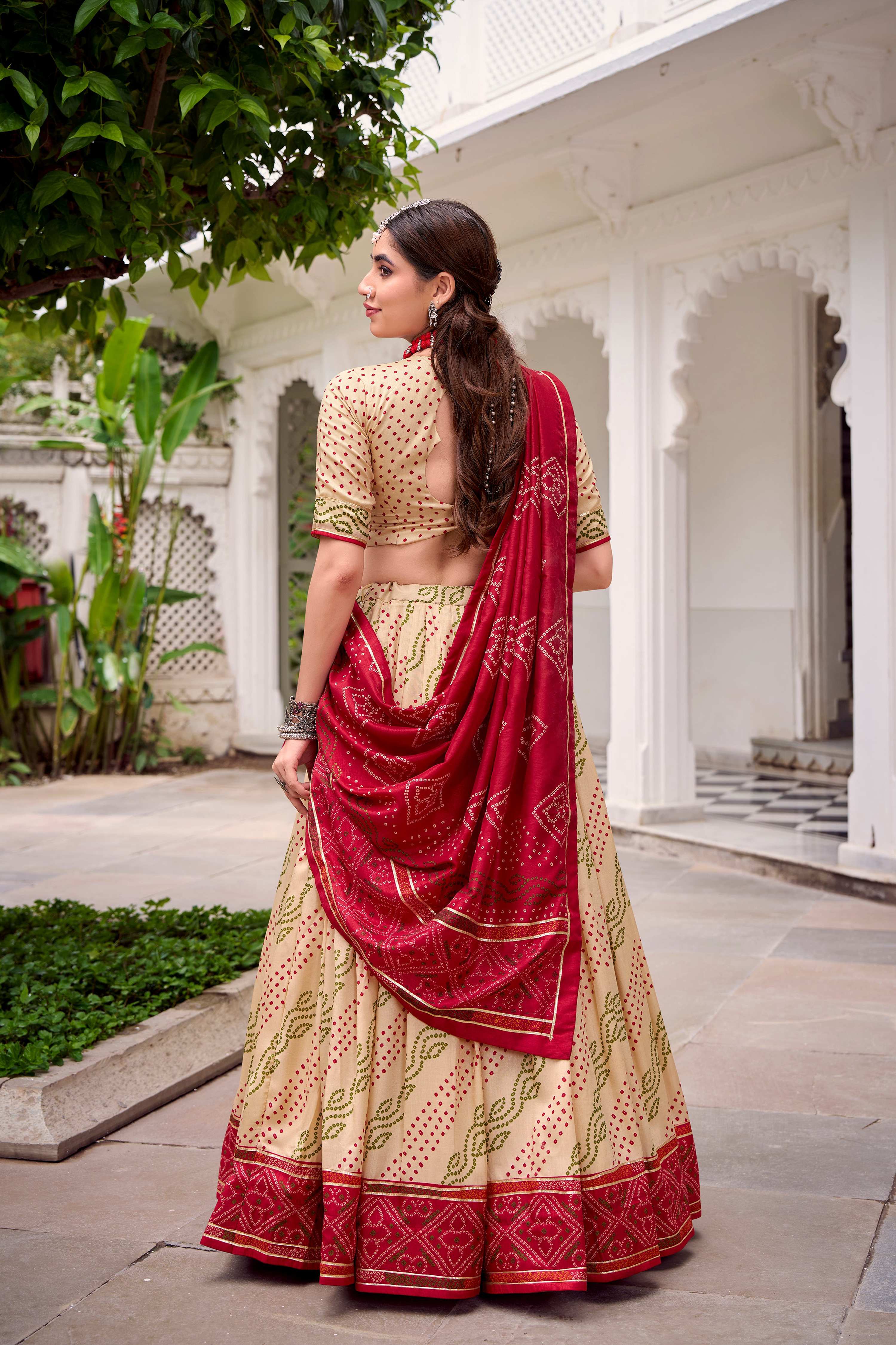 Evanik Offwhite Tassa Silk With Bandhej Print Lehenga Choli