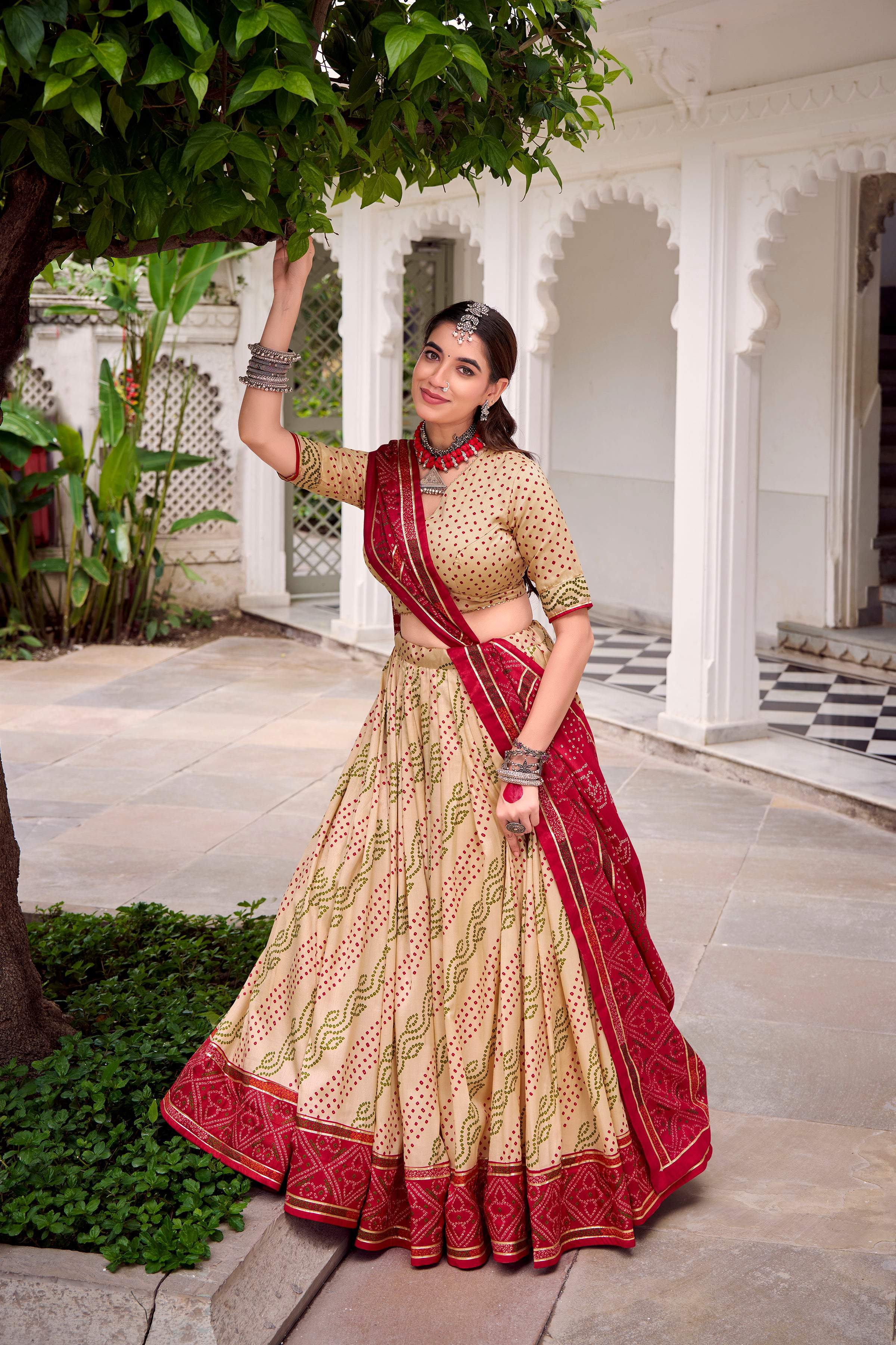 Evanik Offwhite Tassa Silk With Bandhej Print Lehenga Choli