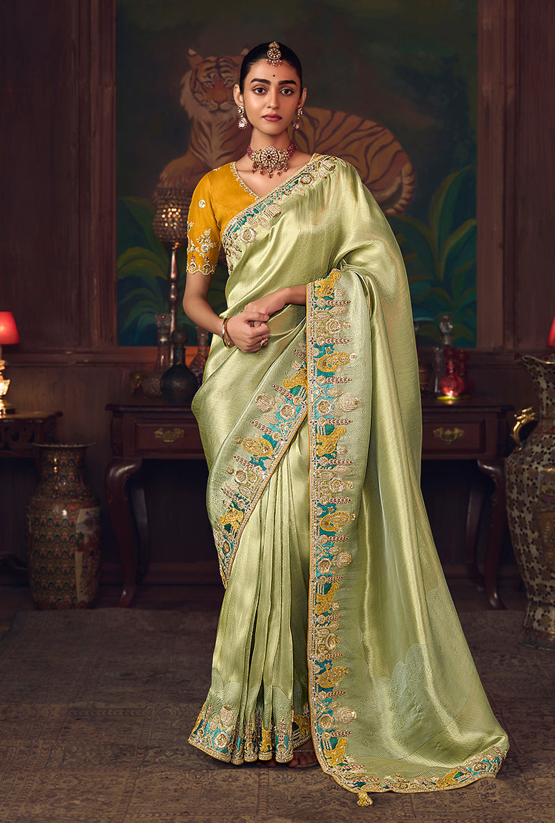 Monjolika Fashion Light Green Zari Woven Silk Blend Embroidered Saree For Wedding Wear