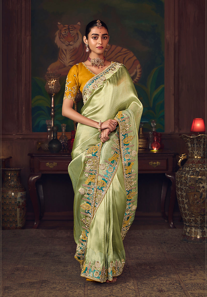 Monjolika Fashion Light Green Zari Woven Silk Blend Embroidered Saree For Wedding Wear