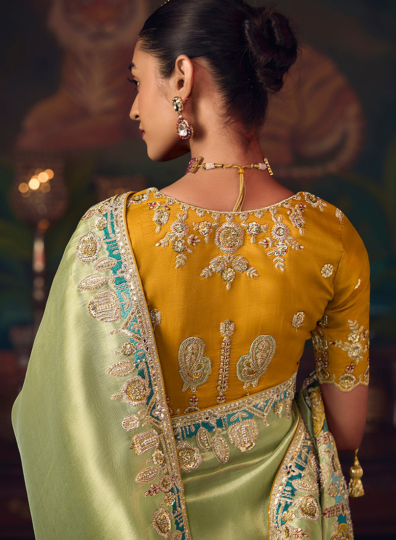 Monjolika Fashion Light Green Zari Woven Silk Blend Embroidered Saree For Wedding Wear