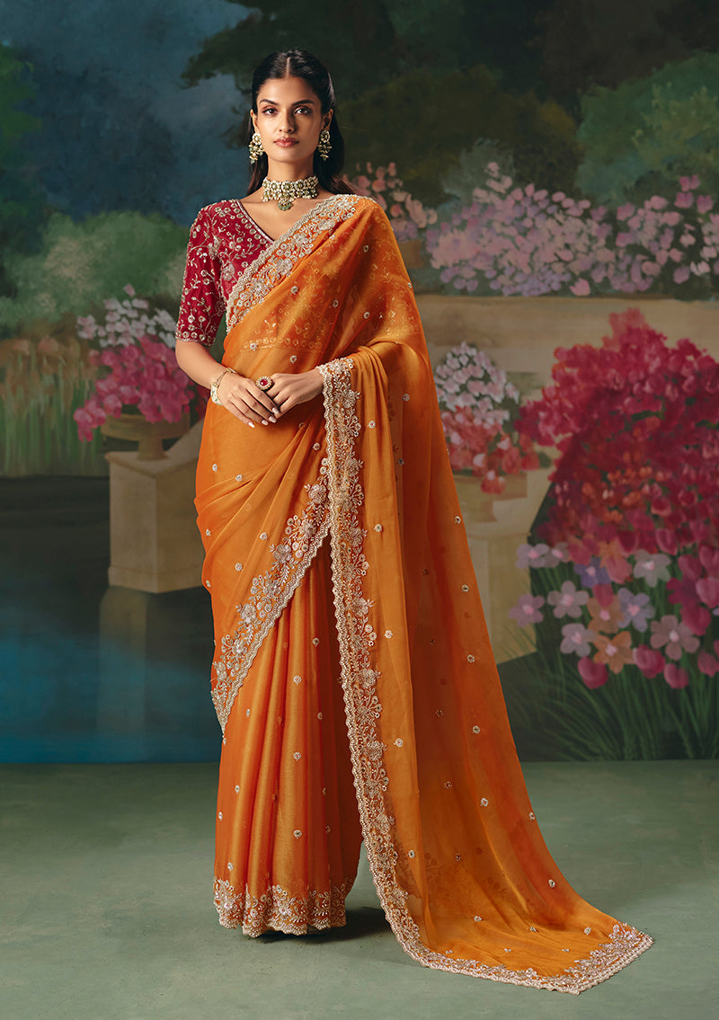 Monjolika Fashion Fancy Fabric Embroidered Saree in Orange
