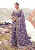 Monjolika Fashion Lavender Purple Embroidered Woven Faux Tissue Silk Saree