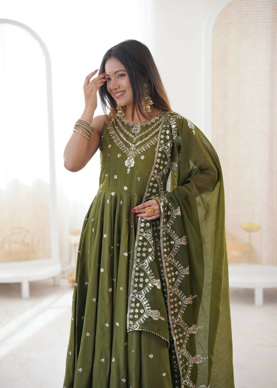 Teeya Creation Green Color Roman Silk Embroidery Work Party Wear Gown