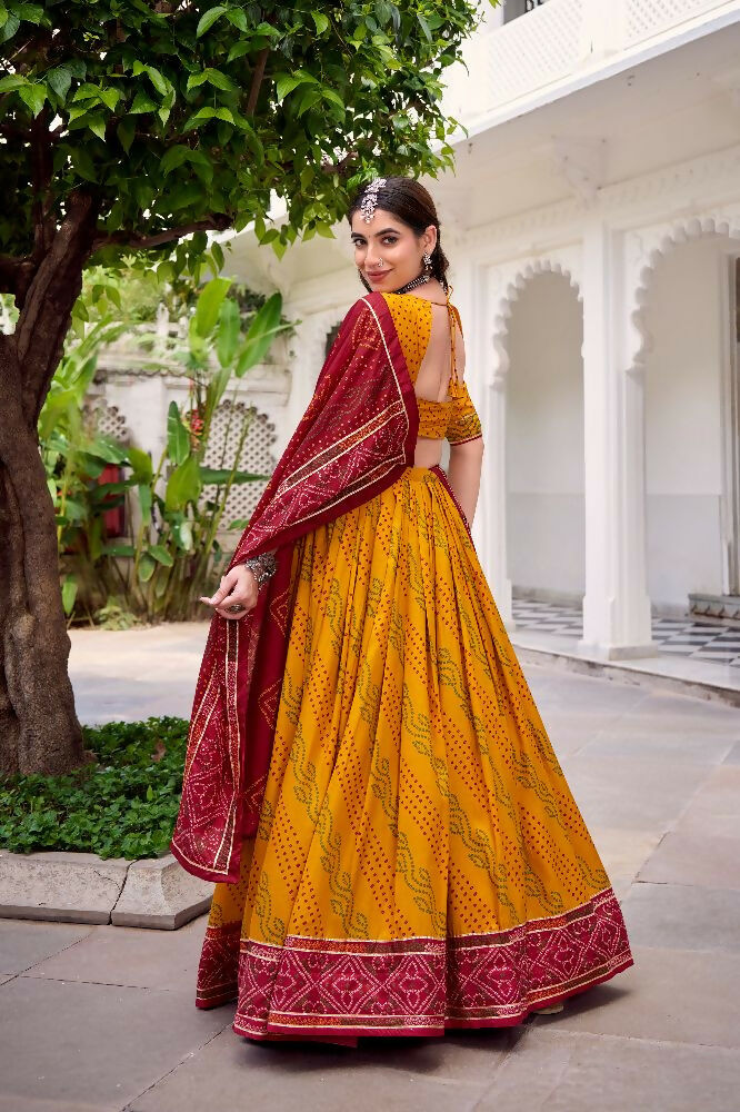 Evanik Yellow Tassa Silk With Bandhej Print Lehenga Choli