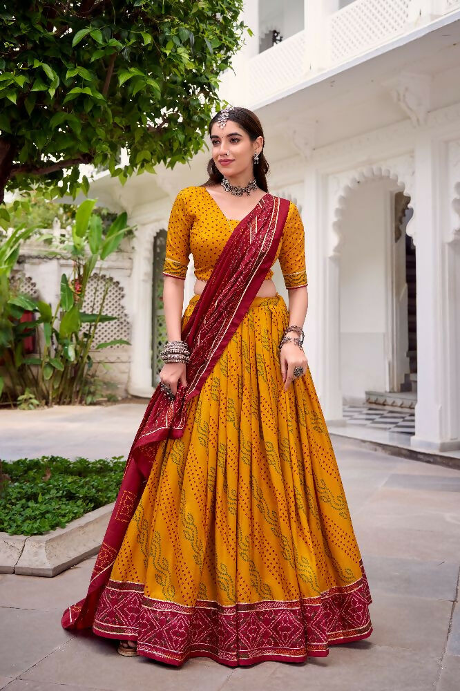 Evanik Yellow Tassa Silk With Bandhej Print Lehenga Choli