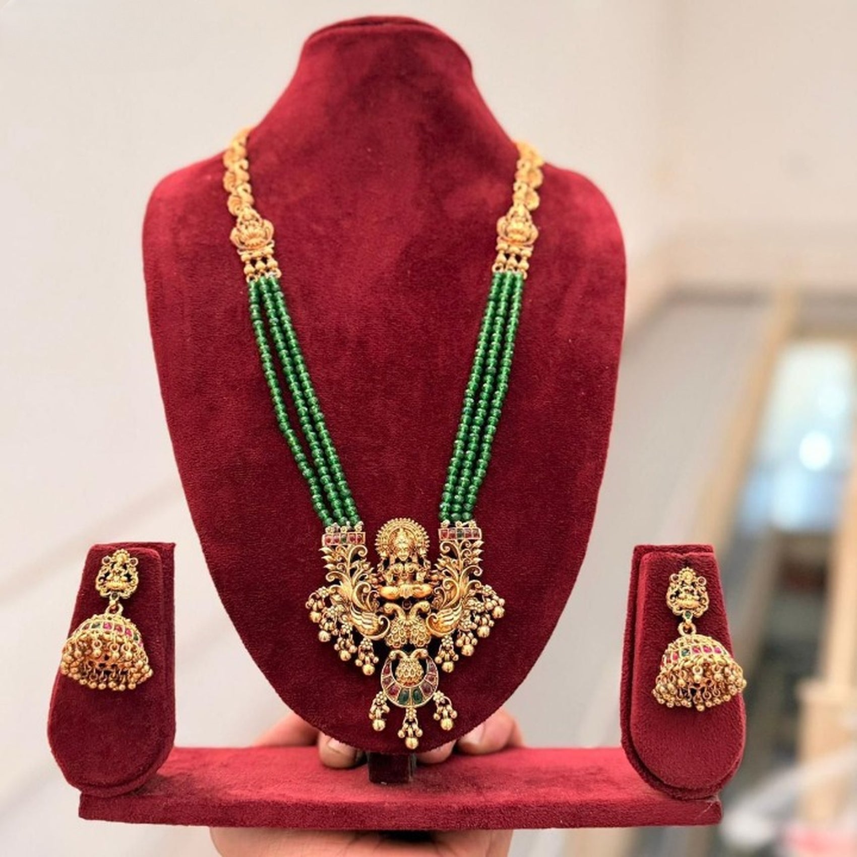 Jewel City Antique Gold-Plated Lakshmi Pendant Green Bead Necklace Set with Jhumka Earrings - Traditional Temple Jewelry