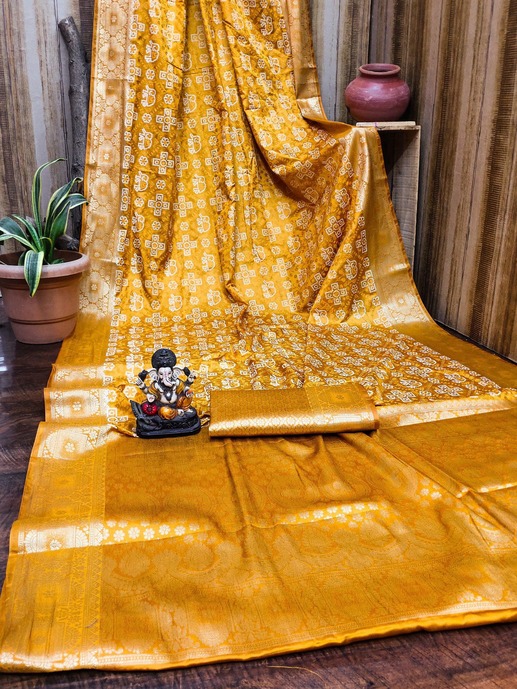 Anaita Yellow Soft Satin Silk Bandhej Print Saree With Kanchi Zari Weaving Border
