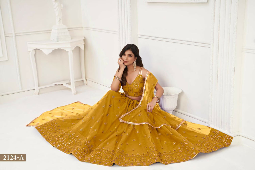 Aastha Fashion Mustard Yellow Butterfly Net Tone To Tone Thread Work And Sandwich Sequence Work Embroidery Wedding Wear Lehenga Choli