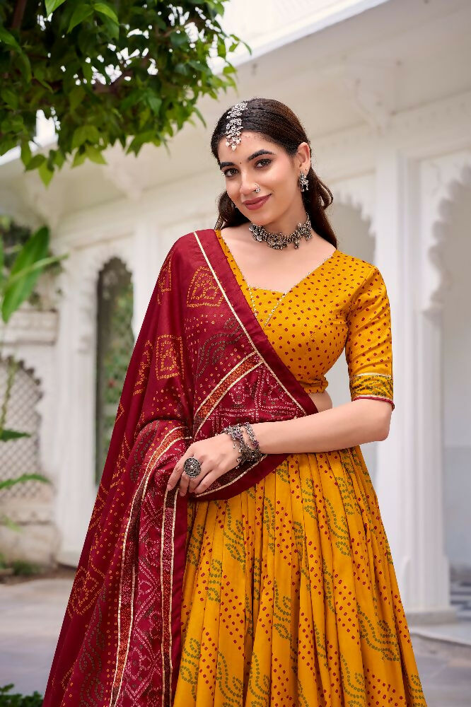 Evanik Yellow Tassa Silk With Bandhej Print Lehenga Choli