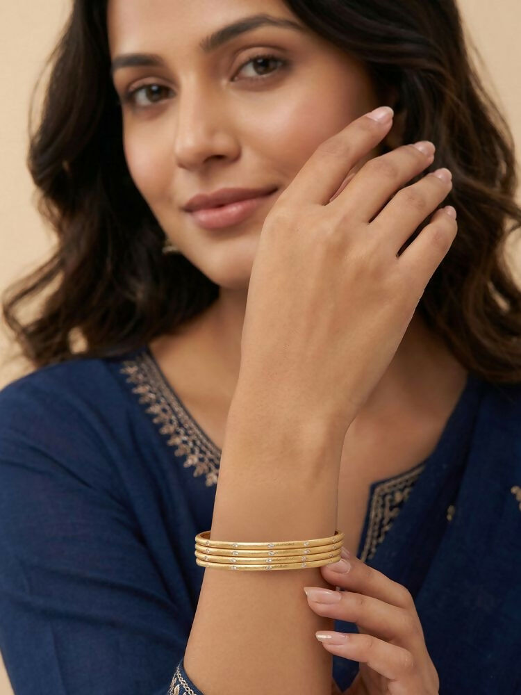 NVR Women Set of 4 Gold Plated Handcrafted CZ Studded Bangle